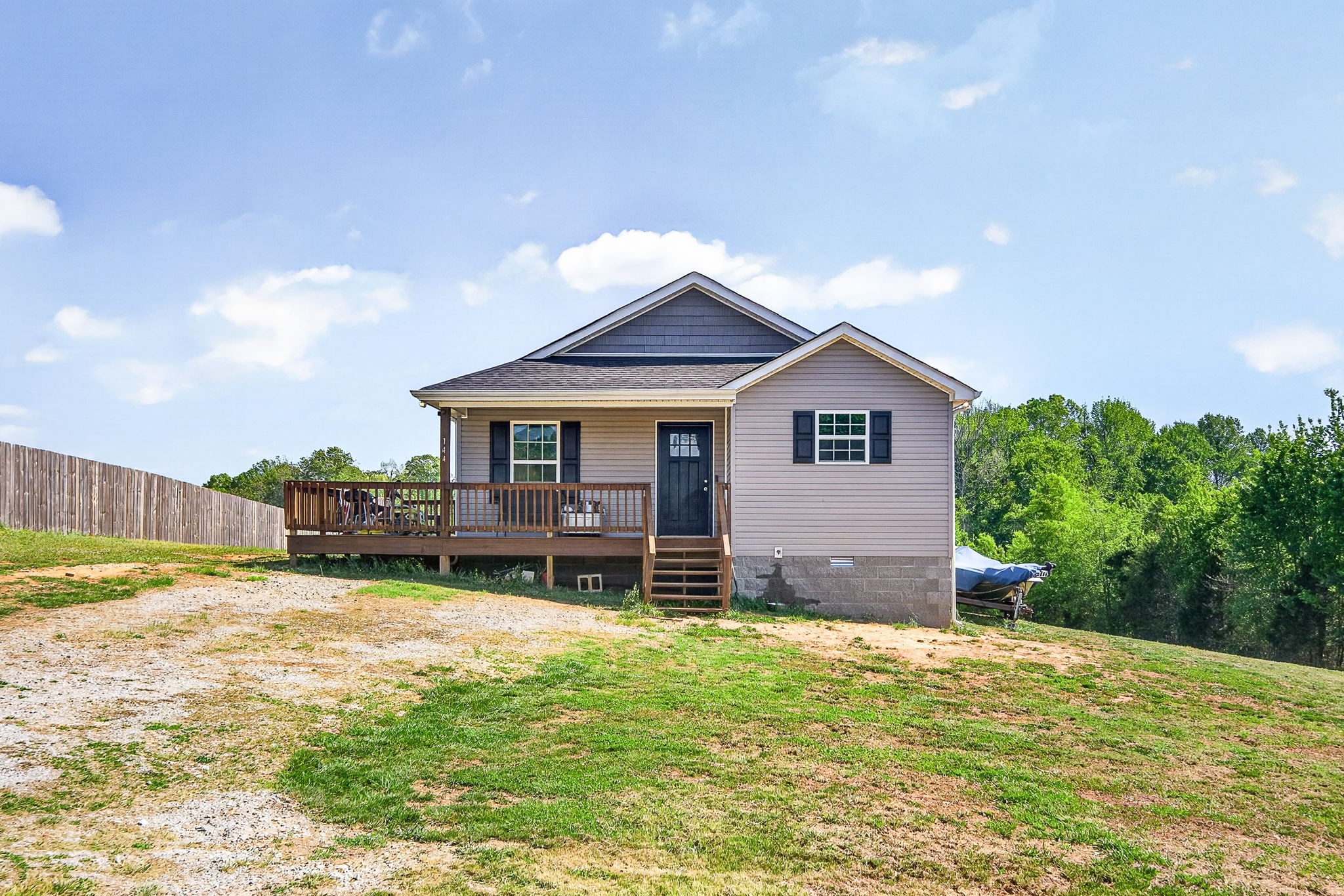 144 Liberty Road Sparta, TN 38583 - Photo 1 of 24 a house view with a sitting space and garden