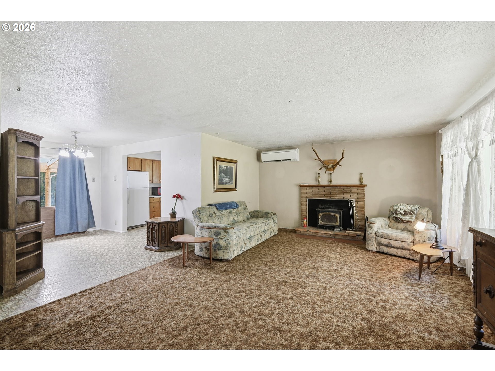 49782 Huckleberry Road Oakridge, OR 97463 - Photo 9 of 21 a living room with furniture and a fireplace