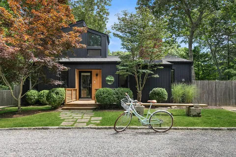 a view of a house with a yard and plants