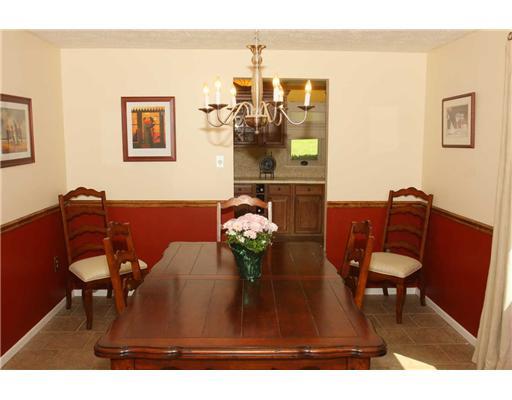 Dining Room. Nice size Dining Room w/ chair rail  & decorative chandlier