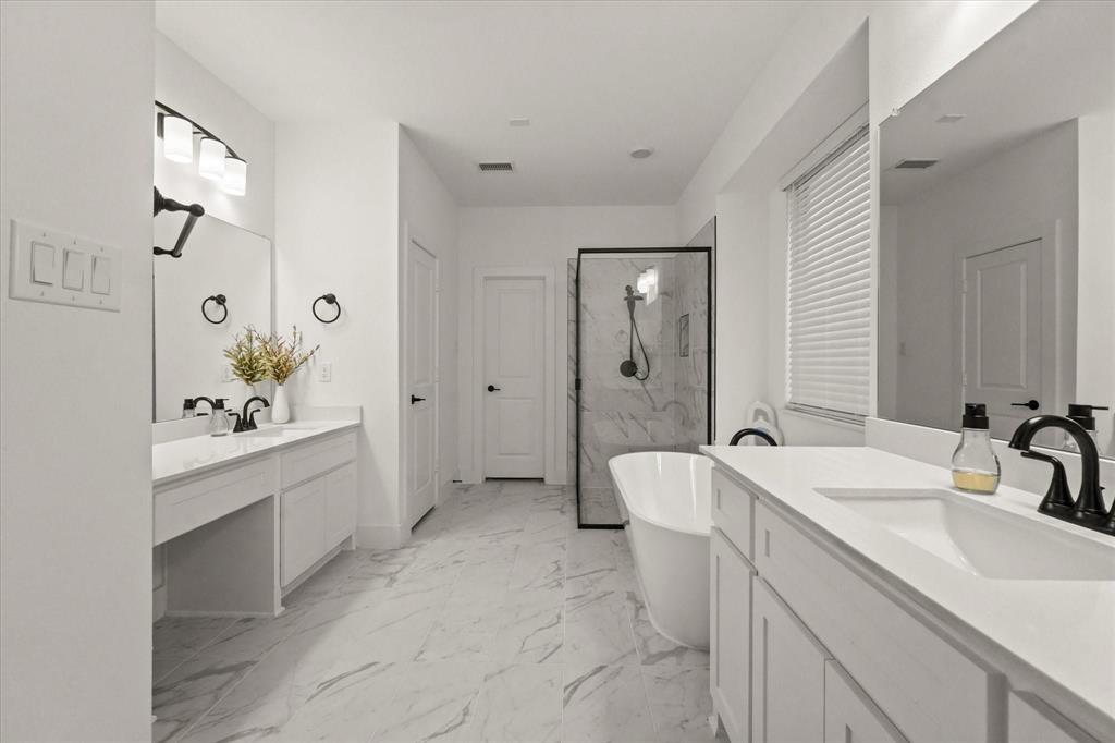 1714 Highwood Road Forney, TX 75126 - Photo 24 of 30 a spacious bathroom with a double vanity sink mirror double vanity and shower