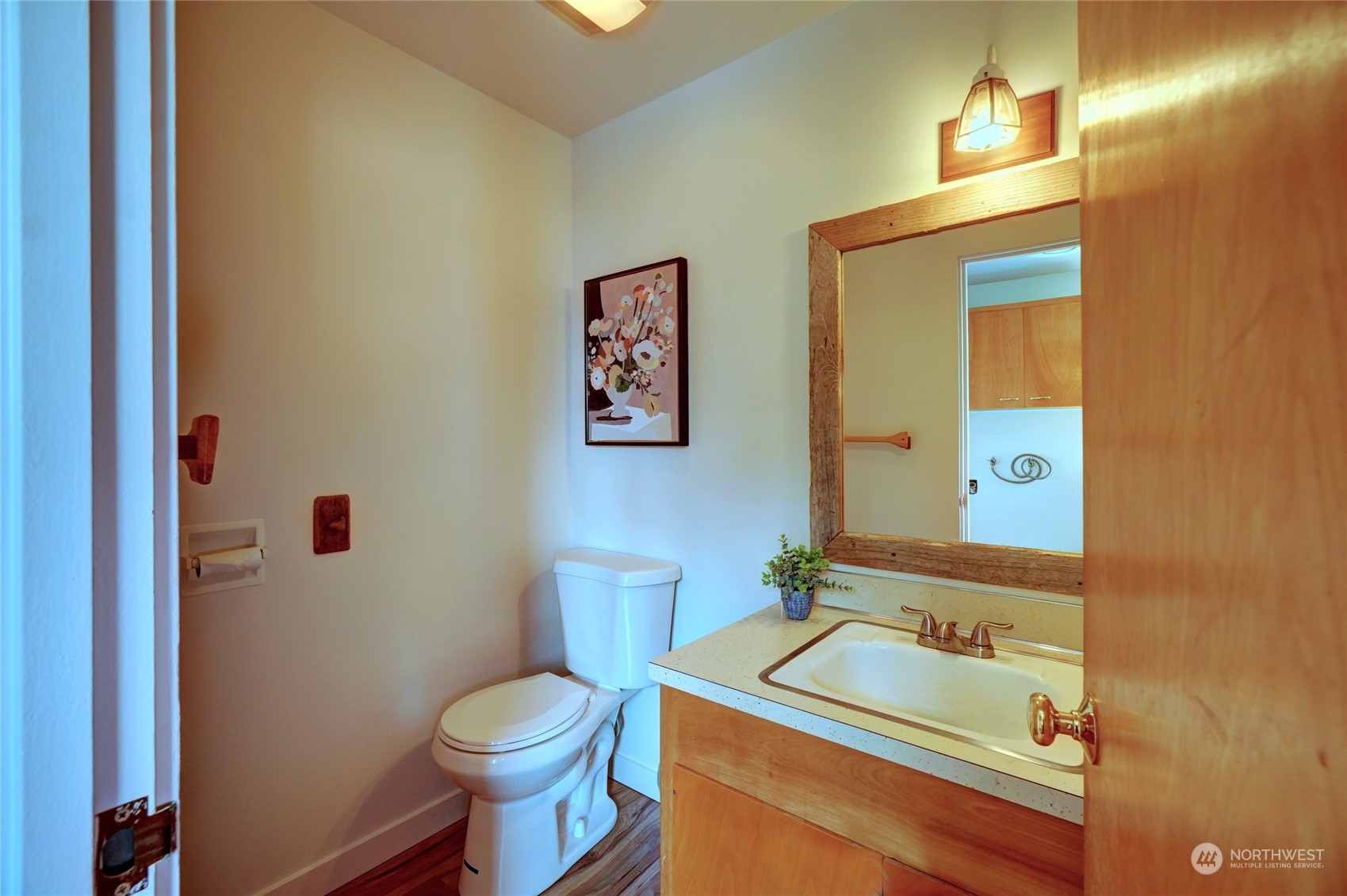 12922 Thomas Road Northwest Gig Harbor, WA 98329 - Photo 14 of 38 a bathroom with a sink mirror vanity and toilet