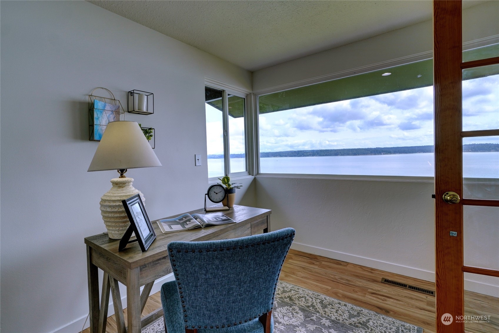 12922 Thomas Road Northwest Gig Harbor, WA 98329 - Photo 15 of 38 a living room with furniture and a large window