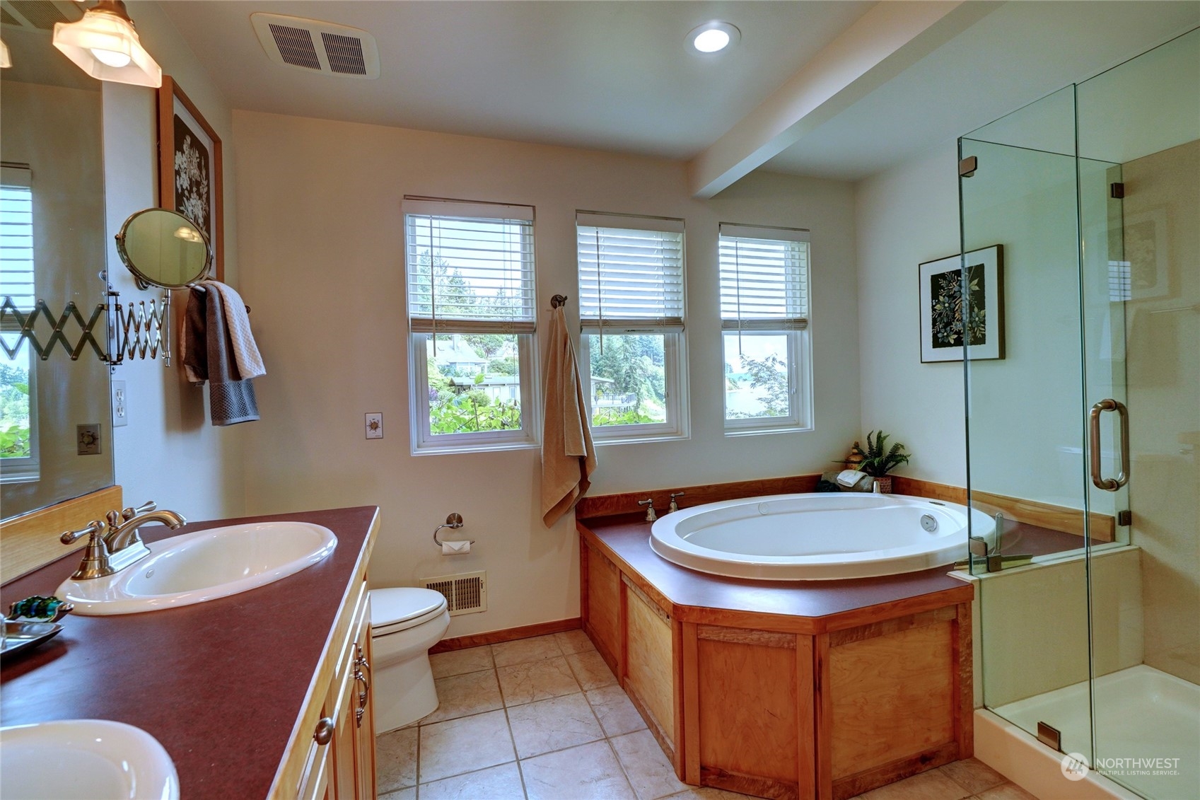 12922 Thomas Road Northwest Gig Harbor, WA 98329 - Photo 18 of 38 a bathroom with a tub sink and mirror