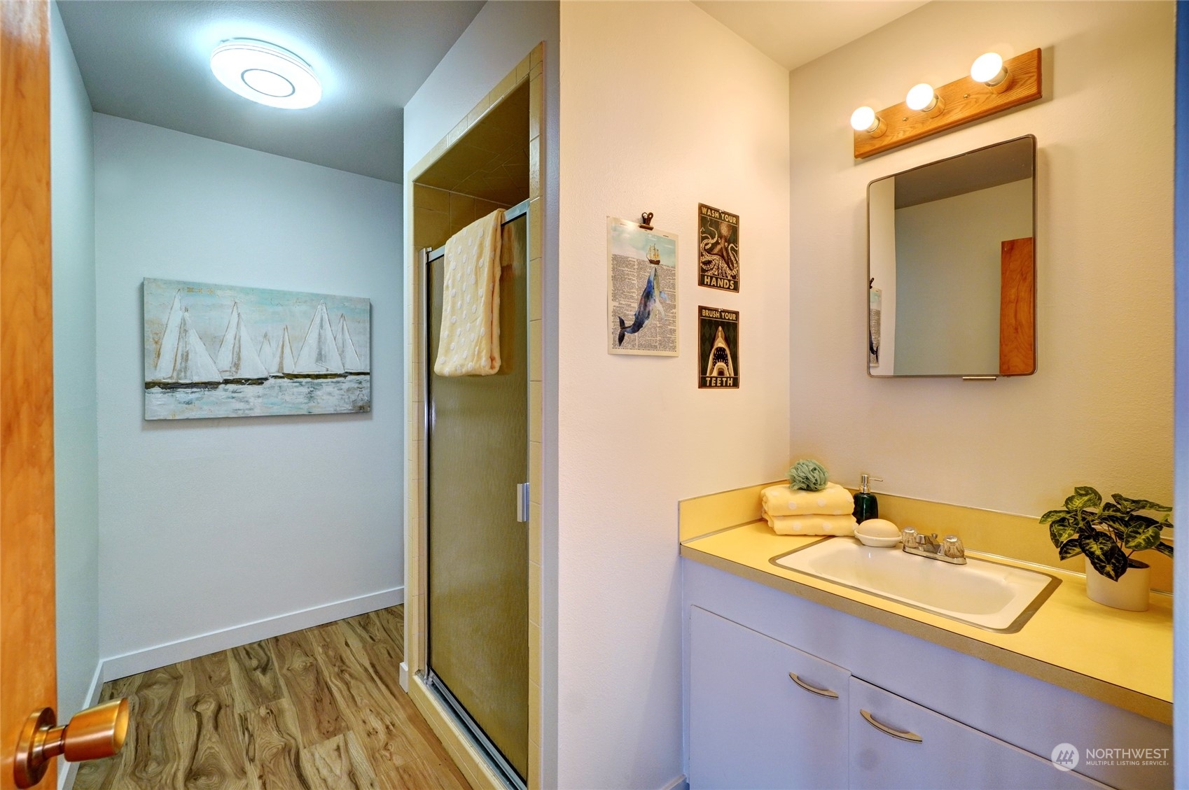 12922 Thomas Road Northwest Gig Harbor, WA 98329 - Photo 22 of 38 a bathroom with a sink and a mirror