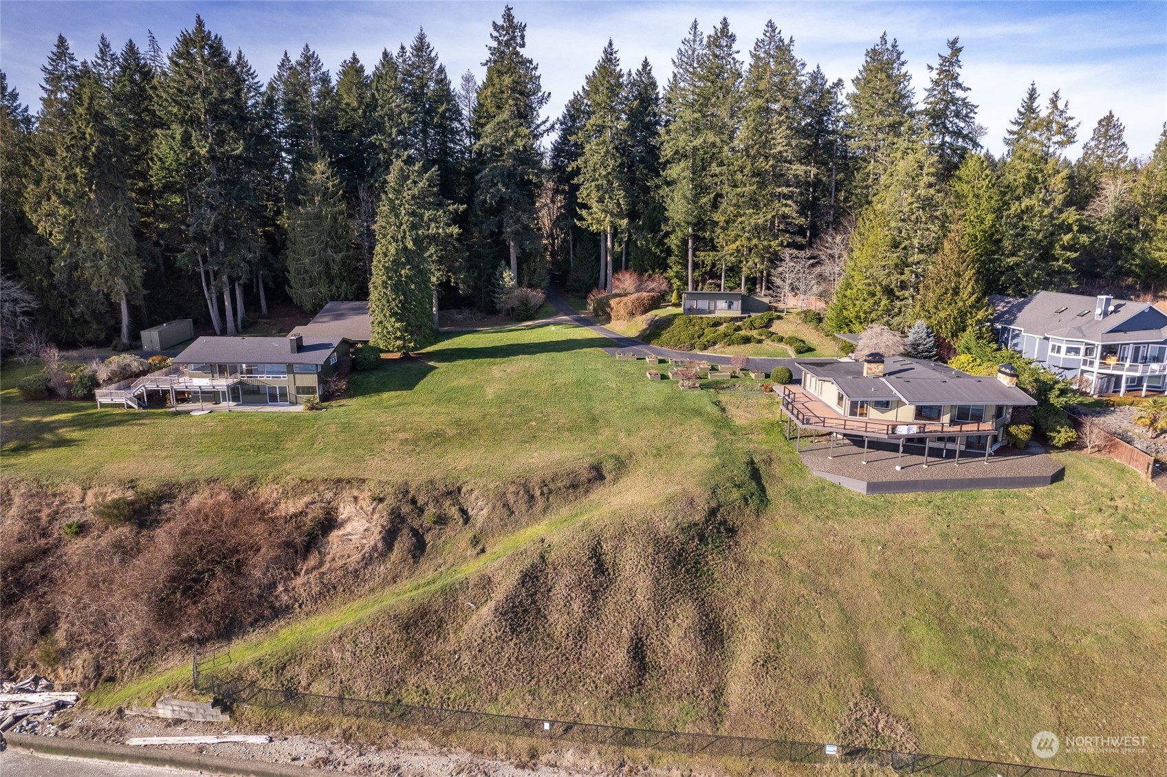12922 Thomas Road Northwest Gig Harbor, WA 98329 - Photo 5 of 38 a view of a swimming pool with sitting area