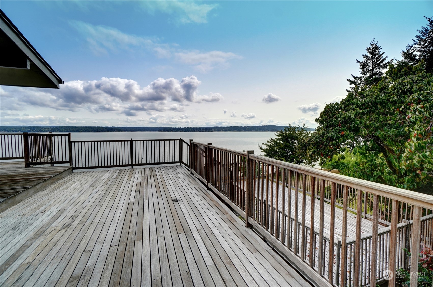 12922 Thomas Road Northwest Gig Harbor, WA 98329 - Photo 8 of 38 a view of balcony with wooden floor