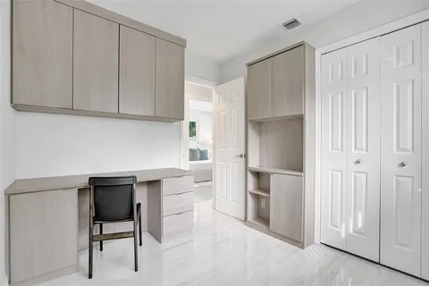 a kitchen with stainless steel appliances a refrigerator and cabinets