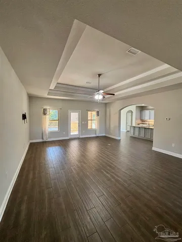 a view of a livingroom with wooden floor