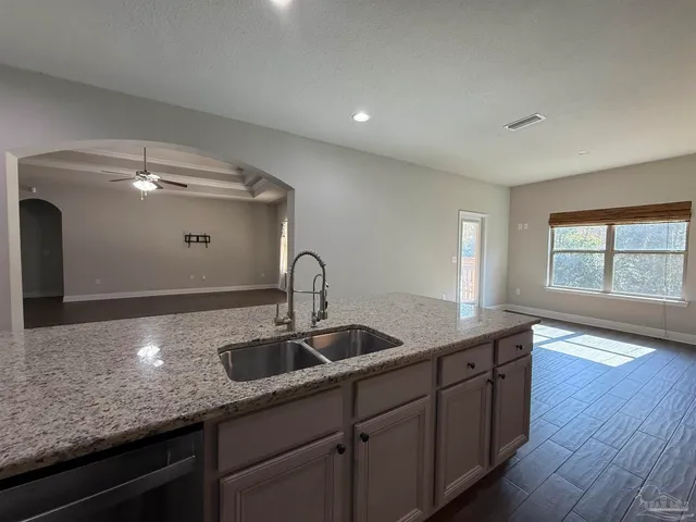 a kitchen with a sink and cabinets