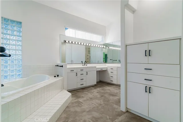 a bathroom with a bathtub and a sink