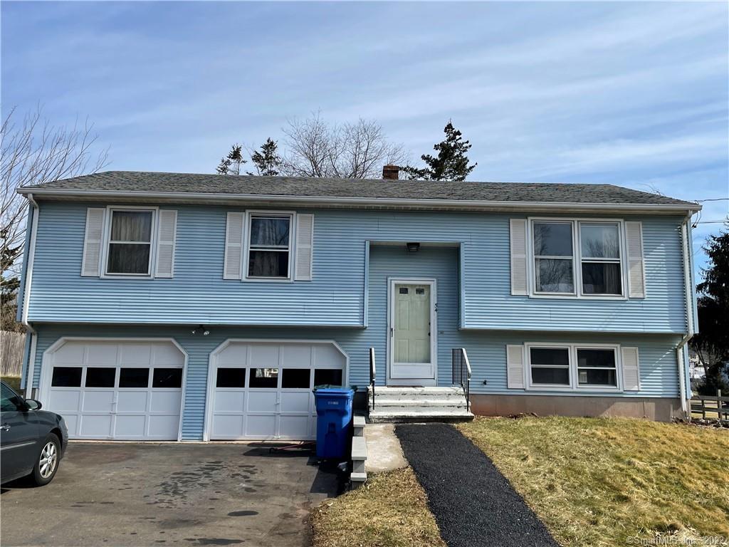 54 Robertson Road Hamden, CT 06518 - Photo 1 of 1 a front view of a house with a yard