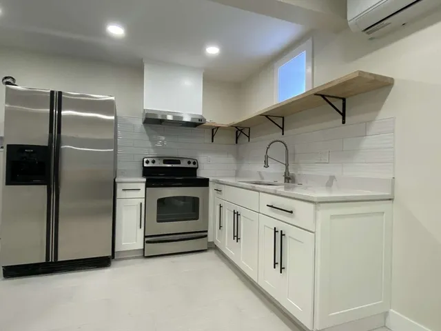 a view of a hallway with a chandelier