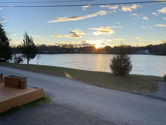 a view of lake with mountain in the background