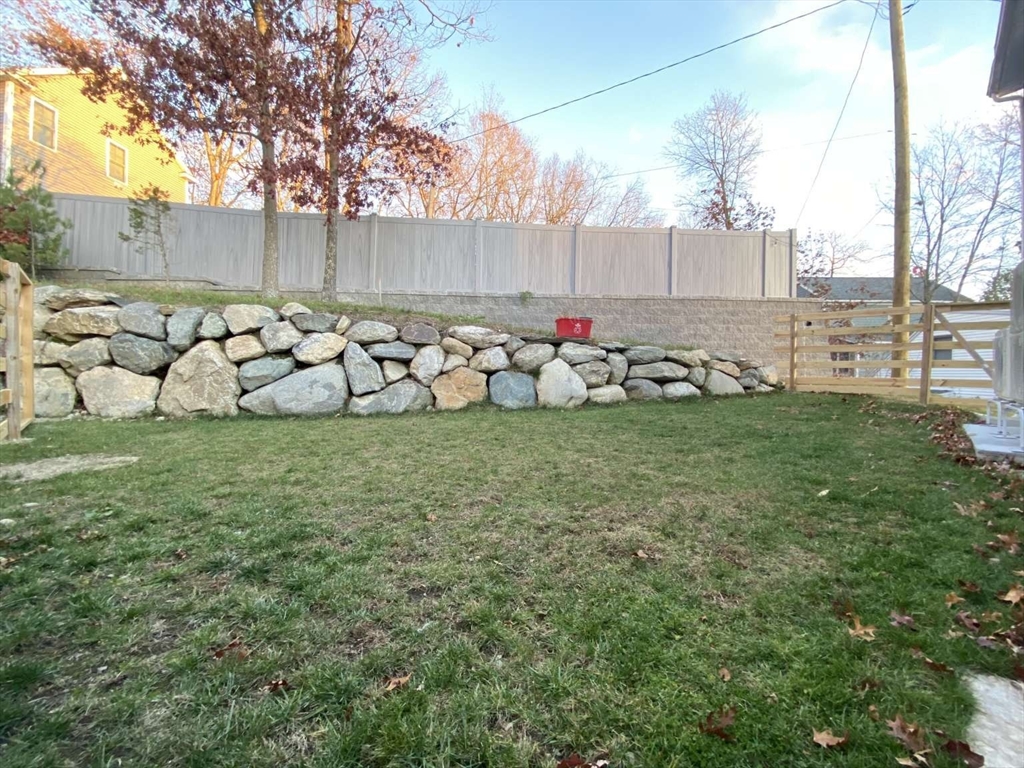 30 Russell Road, Unit 30 Chelmsford, MA 01863 - Photo 4 of 20 a view of a yard with large trees