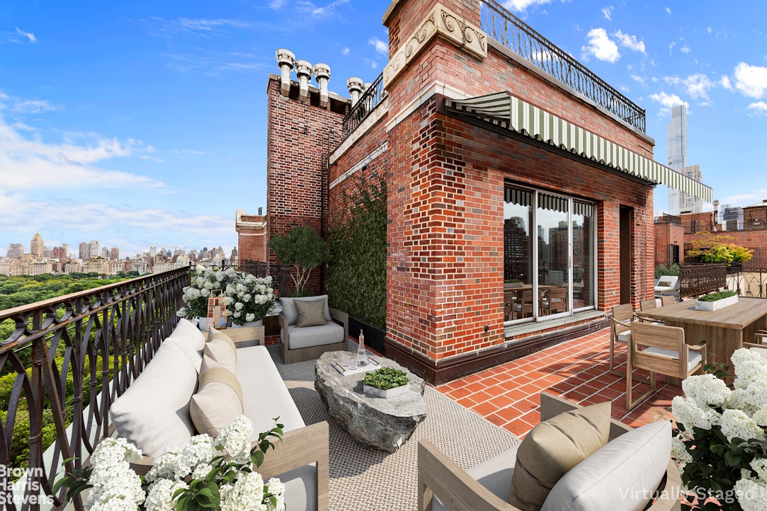 a view of a two chairs in the roof deck