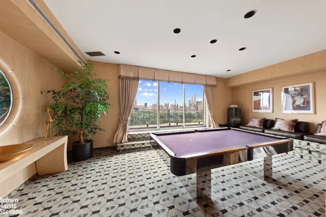 a view of a dining room with furniture and window