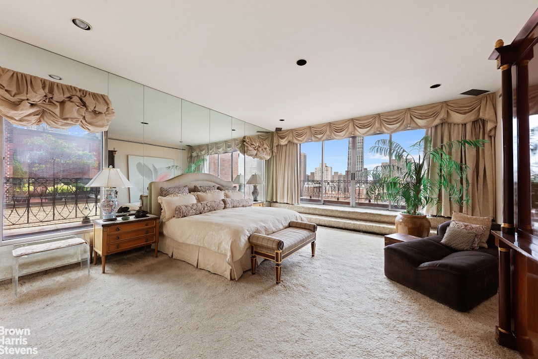 101 Central Park West, Unit PHF Manhattan, NY 10023 - Photo 15 of 27 a bed room with furniture and a large window