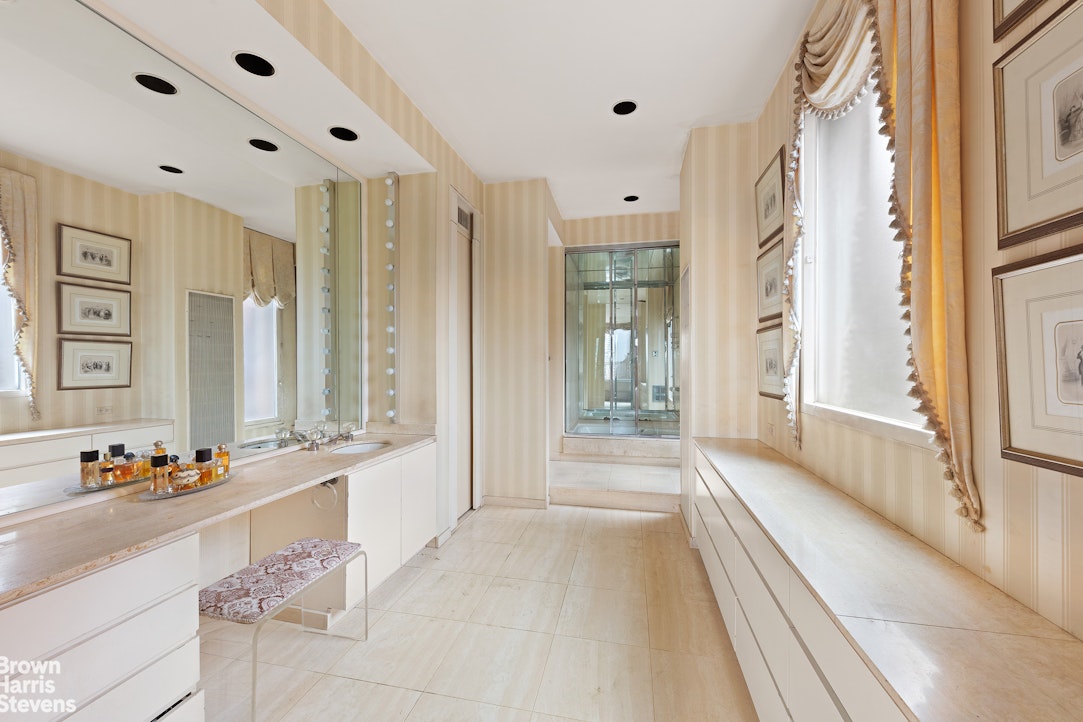 101 Central Park West, Unit PHF Manhattan, NY 10023 - Photo 16 of 27 a spacious en suite bathroom with a tub shower and window