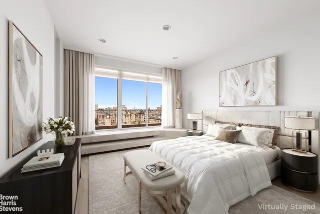a spacious en suite bathroom with a tub shower and window
