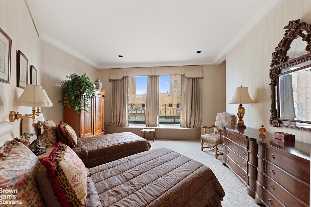 101 Central Park West, Unit PHF Manhattan, NY 10023 - Photo 21 of 27 a bedroom with a large bed and a large window