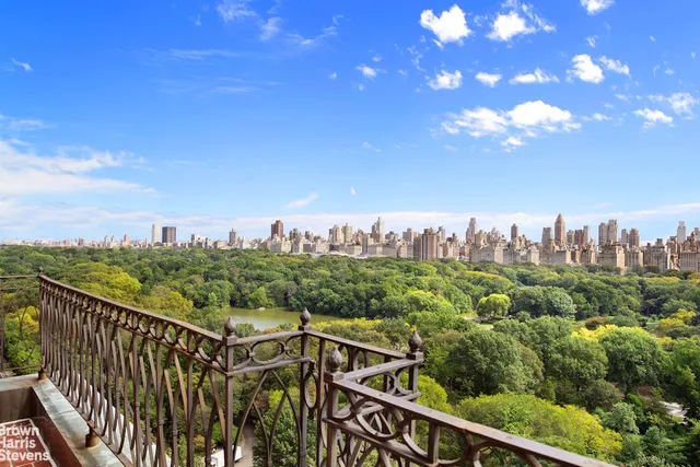 a view of a city skyline from a balcony