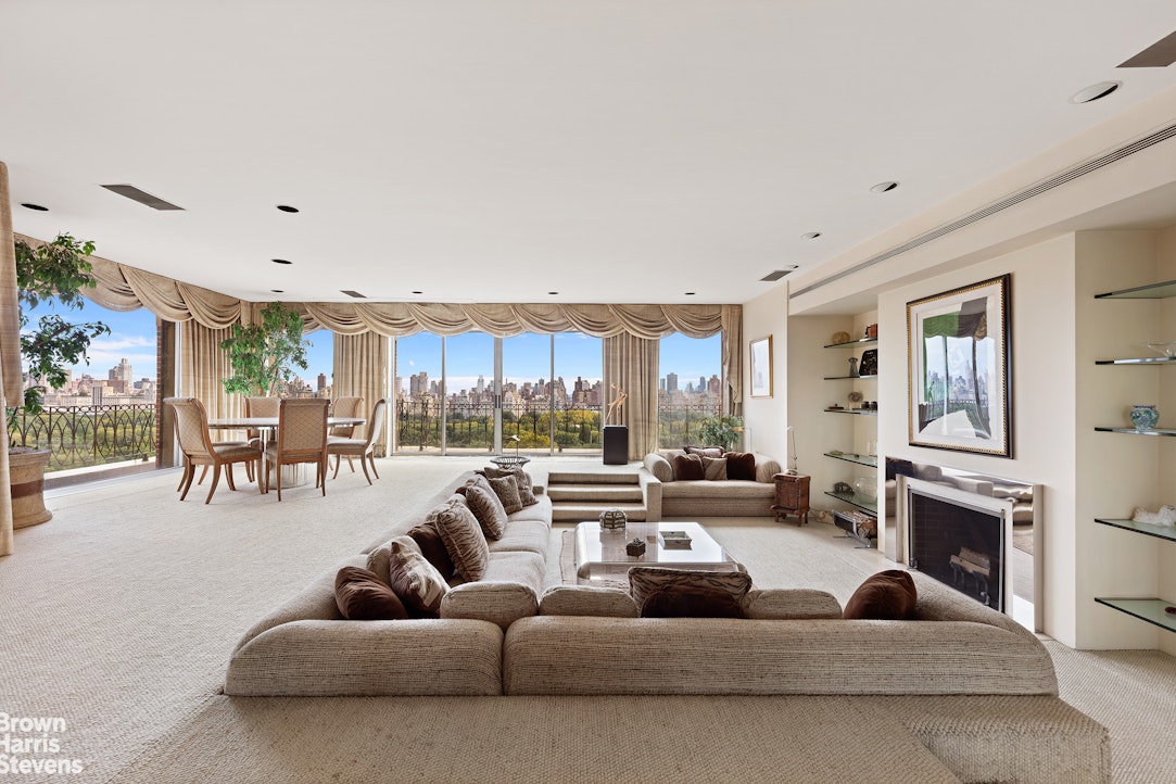 101 Central Park West, Unit PHF Manhattan, NY 10023 - Photo 5 of 27 a living room with furniture and a fireplace