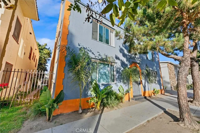 a view of a palm trees in front of a house