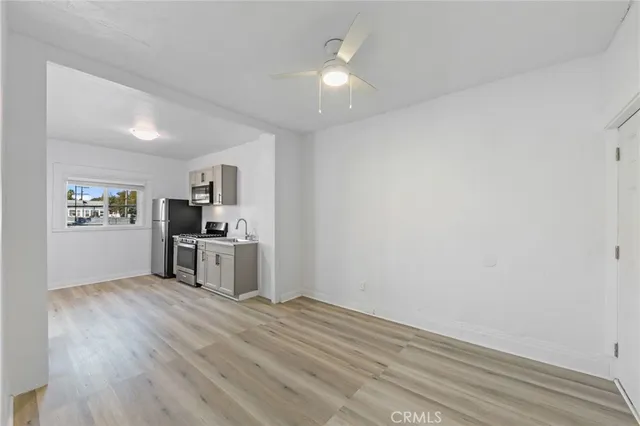 a view of kitchen with wooden floor