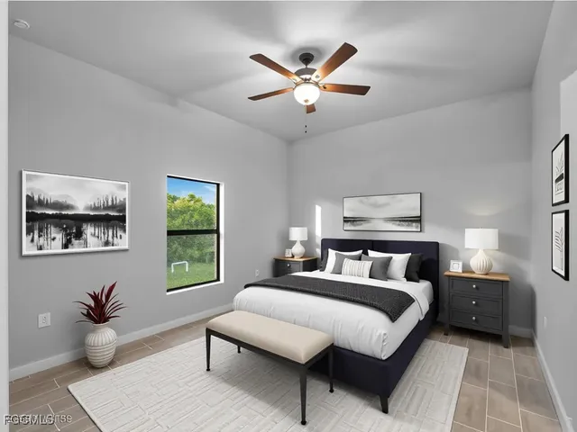 a bedroom with a large bed and a window