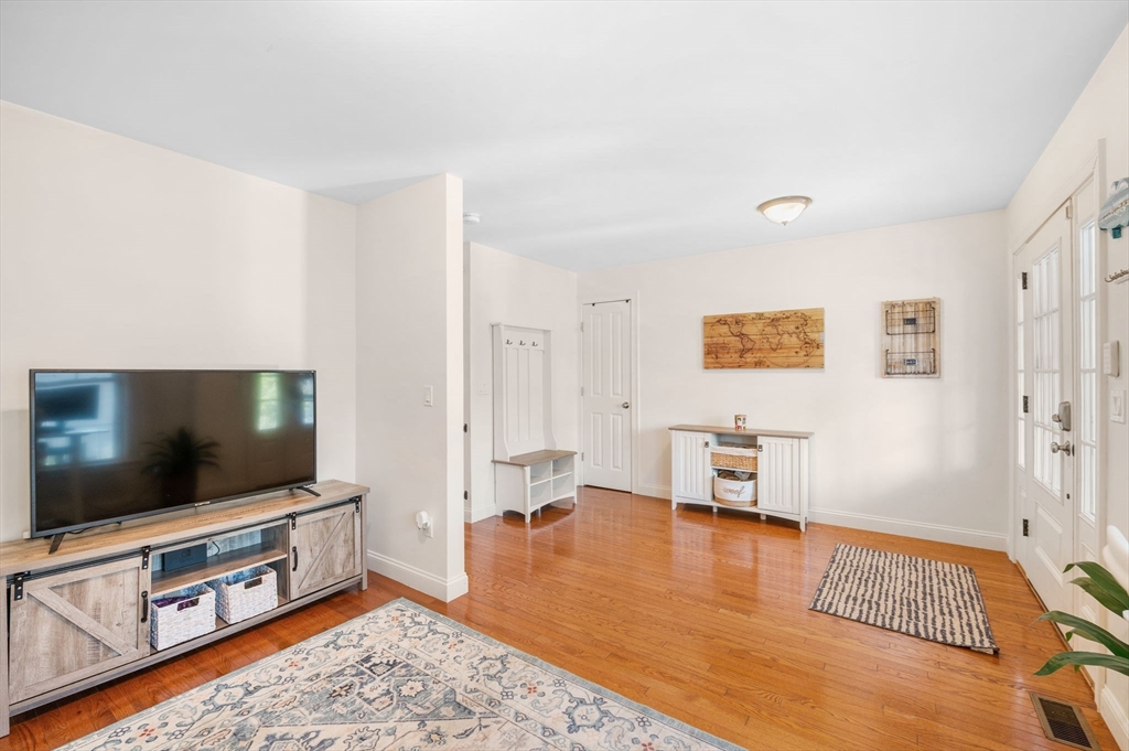 2-4 Gracie Lane, Unit 4 Swampscott, MA 01907 - Photo 11 of 37 a living room with furniture and a flat screen tv
