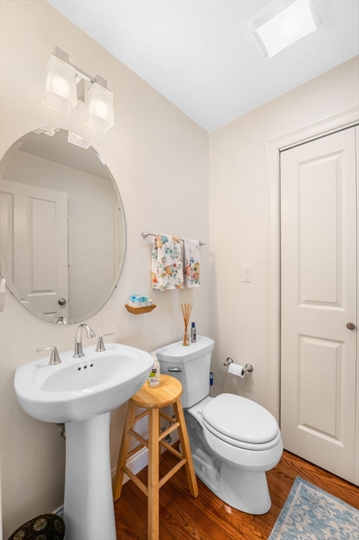 2-4 Gracie Lane, Unit 4 Swampscott, MA 01907 - Photo 21 of 37 a bathroom with a sink a toilet and mirror