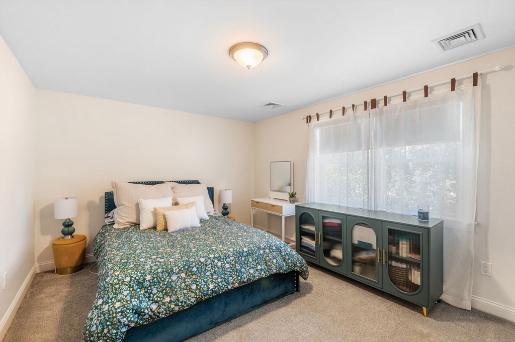 2-4 Gracie Lane, Unit 4 Swampscott, MA 01907 - Photo 24 of 37 a bedroom with a bed and a window