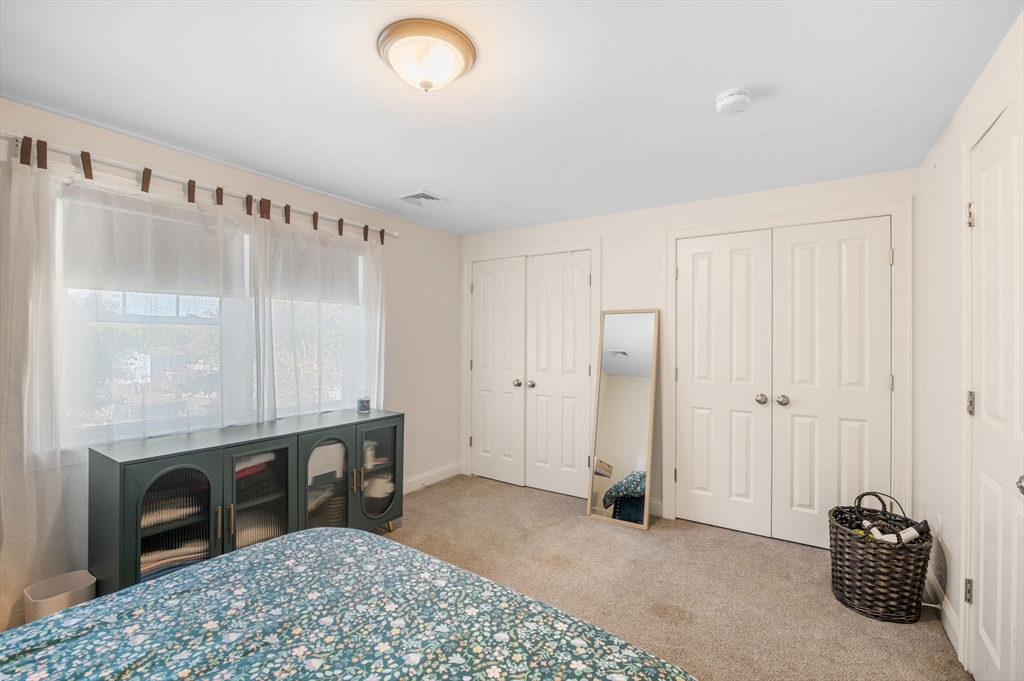 2-4 Gracie Lane, Unit 4 Swampscott, MA 01907 - Photo 25 of 37 a room with a bed and a television