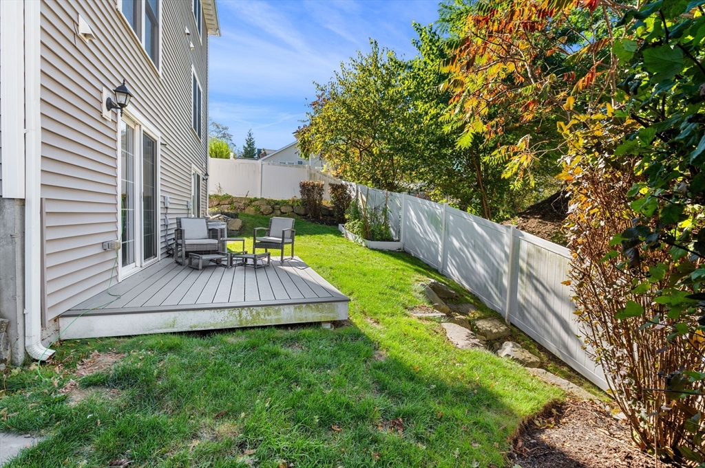 2-4 Gracie Lane, Unit 4 Swampscott, MA 01907 - Photo 34 of 37 a view of house with backyard and outdoor seating