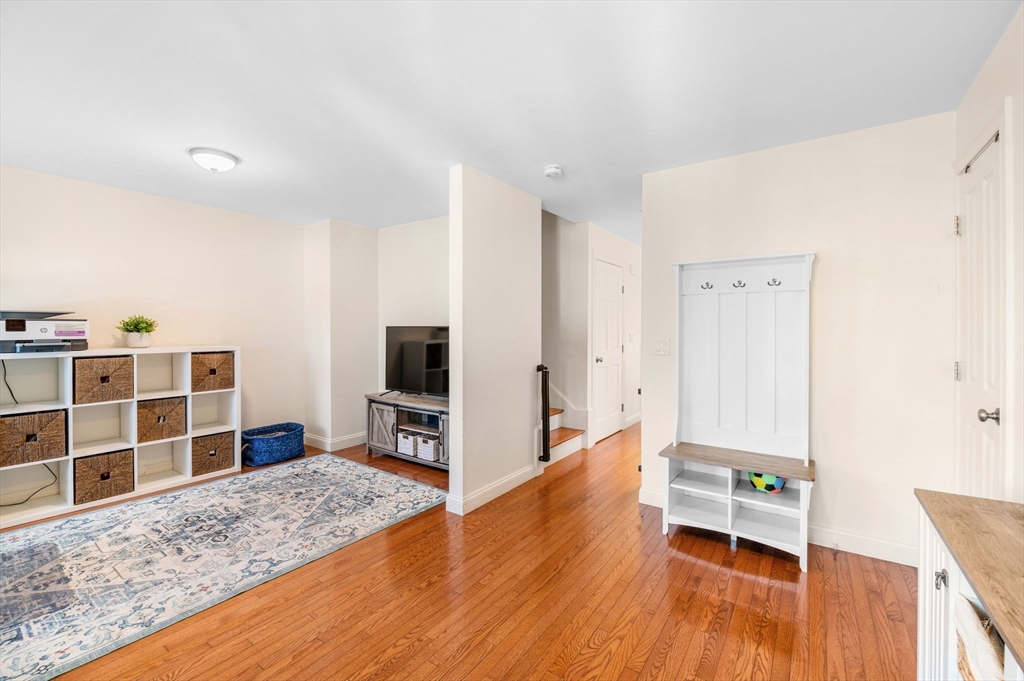 2-4 Gracie Lane, Unit 4 Swampscott, MA 01907 - Photo 8 of 37 a view of a livingroom with furniture and wooden floor