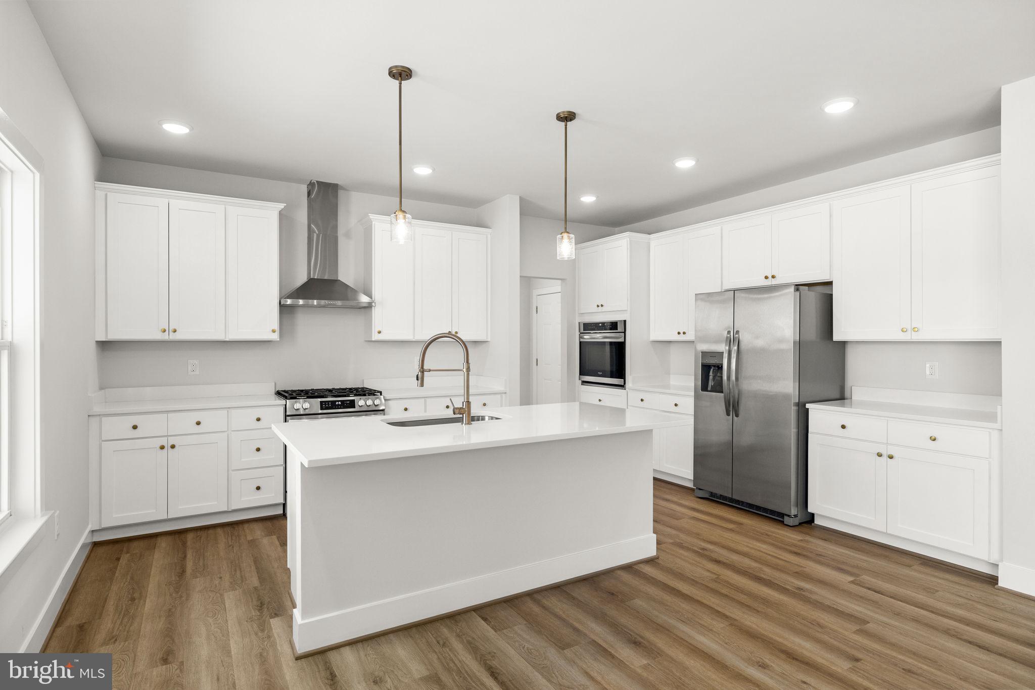 18237 Stevensburg Road Stevensburg, VA 22741 - Photo 15 of 40 Gourmet Kitchen w/ quartz island & white cabinetry
