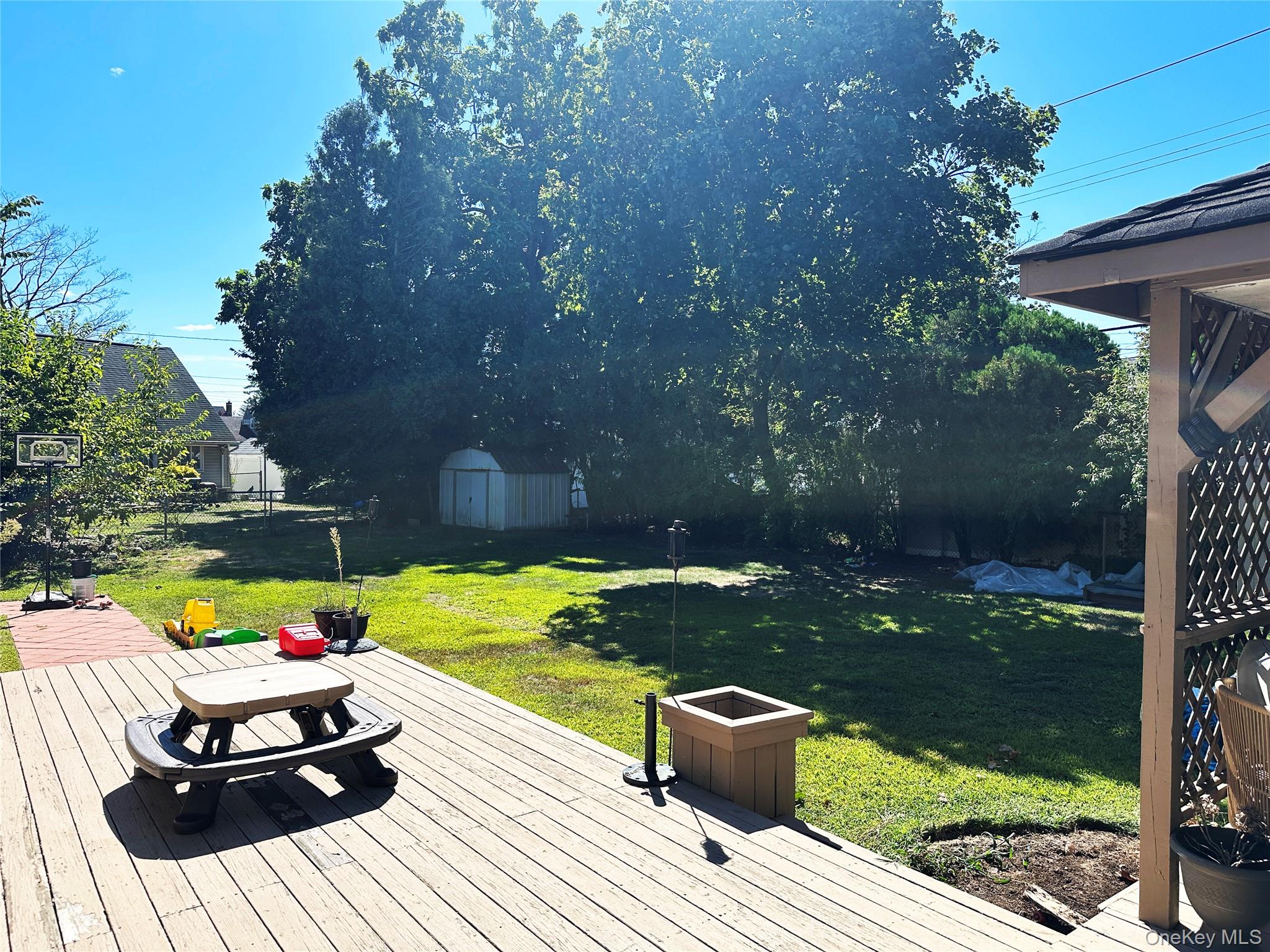 94 Mallard Road Levittown, NY 11756 - Photo 15 of 15 Multi-Level Wooden Deck connecting to Pergola