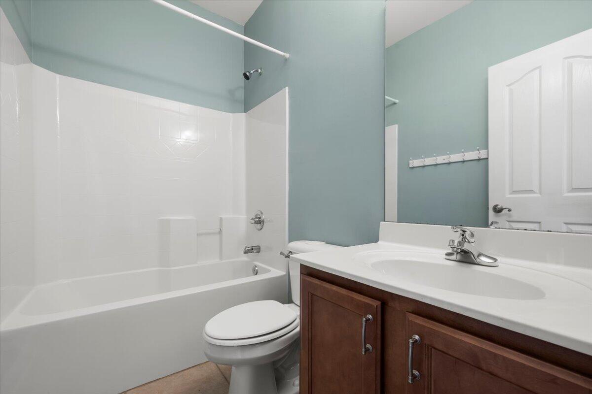 3629 Topaz Circle Navarre, FL 32566 - Photo 11 of 28 a bathroom with a sink a toilet and a bathtub