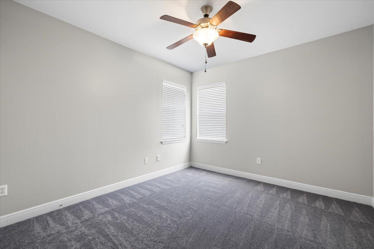 3629 Topaz Circle Navarre, FL 32566 - Photo 12 of 28 an empty room with a window and a fan