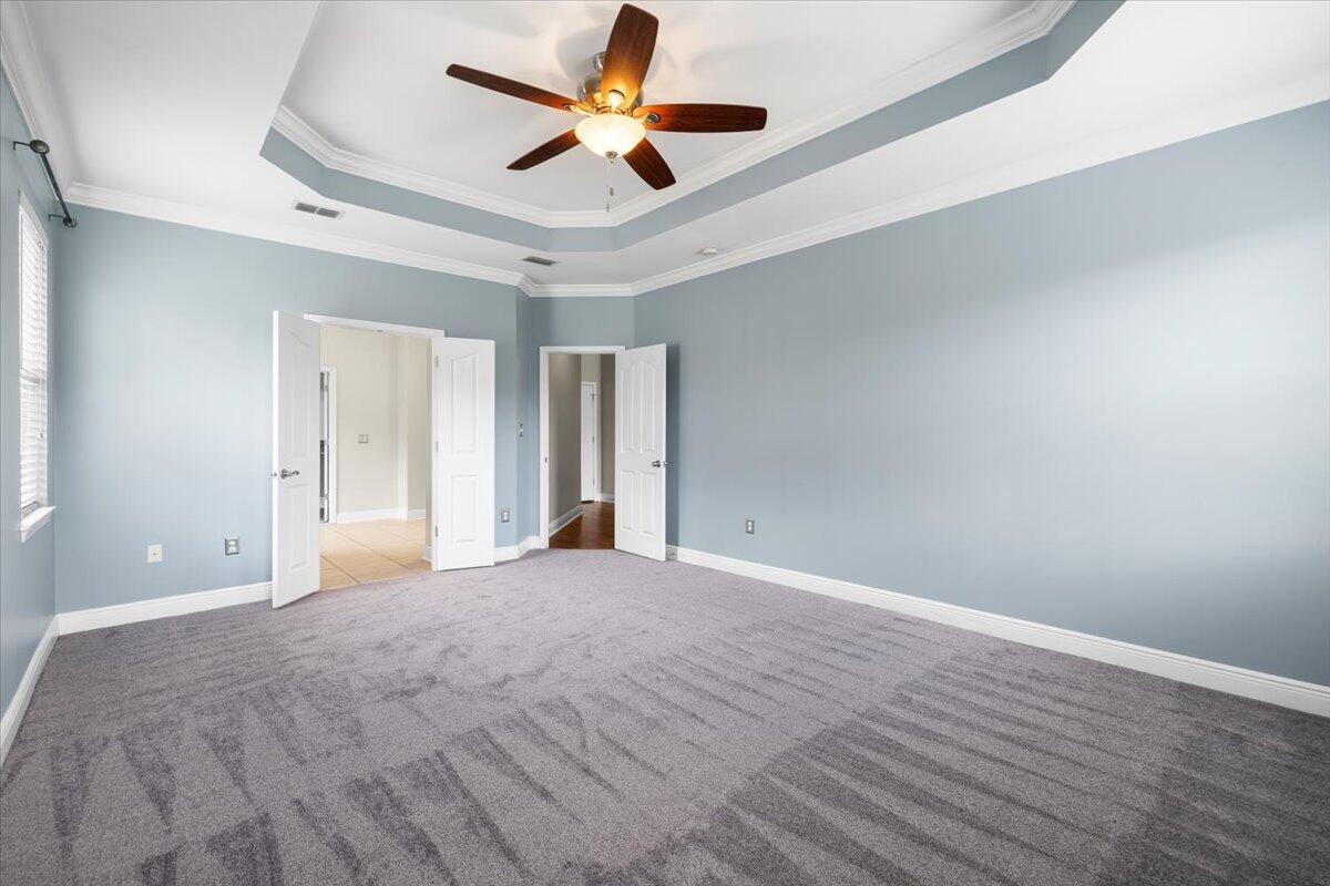 3629 Topaz Circle Navarre, FL 32566 - Photo 23 of 28 a view of an empty room with window and a ceiling fan