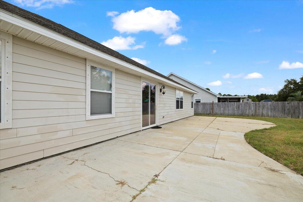 3629 Topaz Circle Navarre, FL 32566 - Photo 27 of 28 a view of a house with backyard