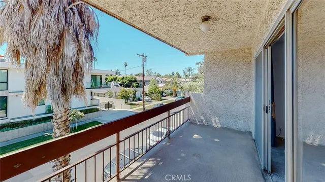a view of balcony with a potted plant