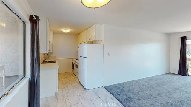 a view of a hallway with windows