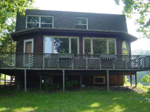 35050 Shoreline Ingleside, IL 60041 - Photo 1 of 1 a front view of a house with a garden