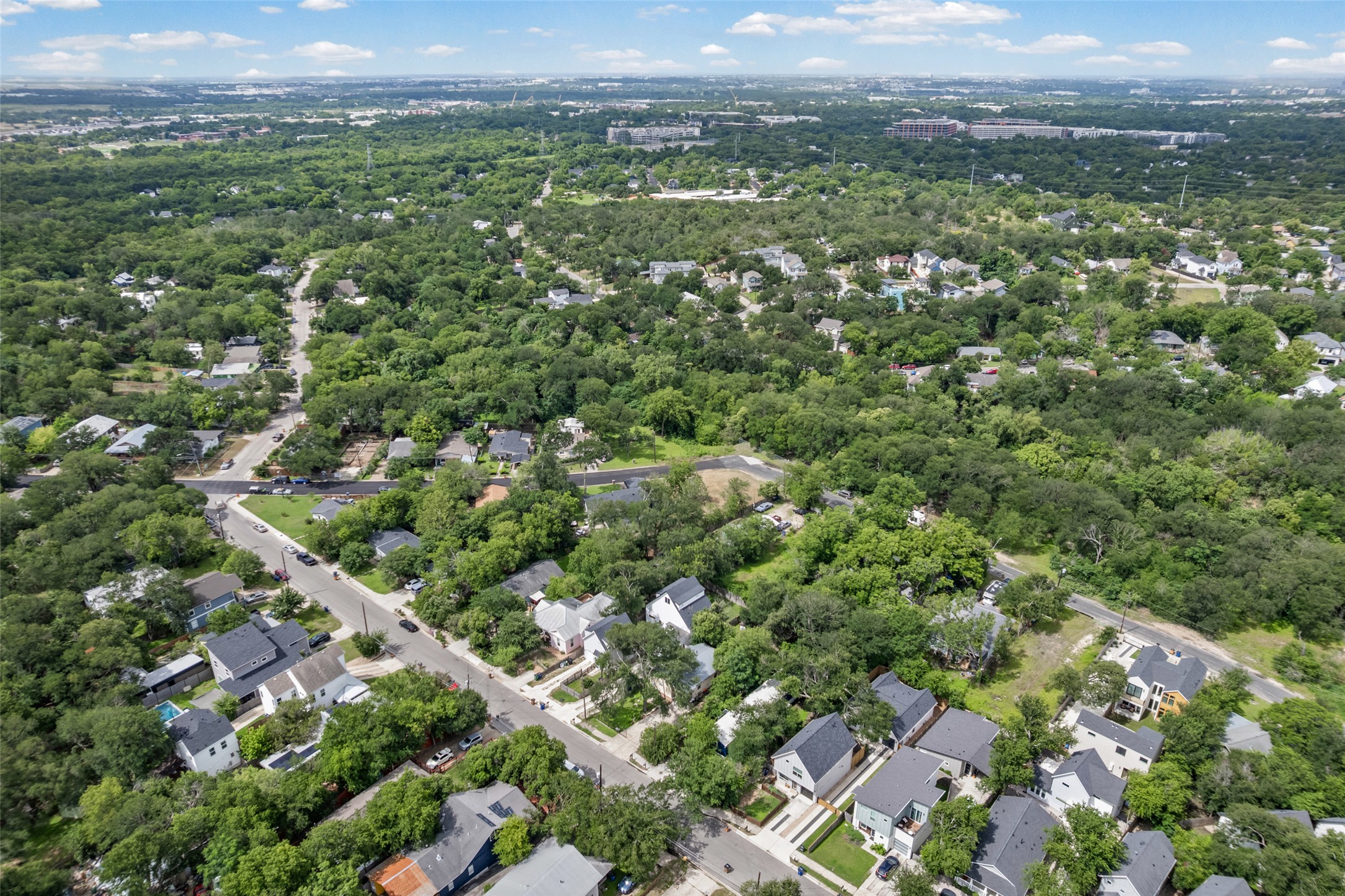 1201 Fort Branch Boulevard Austin, TX 78721 - Photo 7 of 19 An aerial perspective reveals a verdant neighborhood with established trees and residential streets.