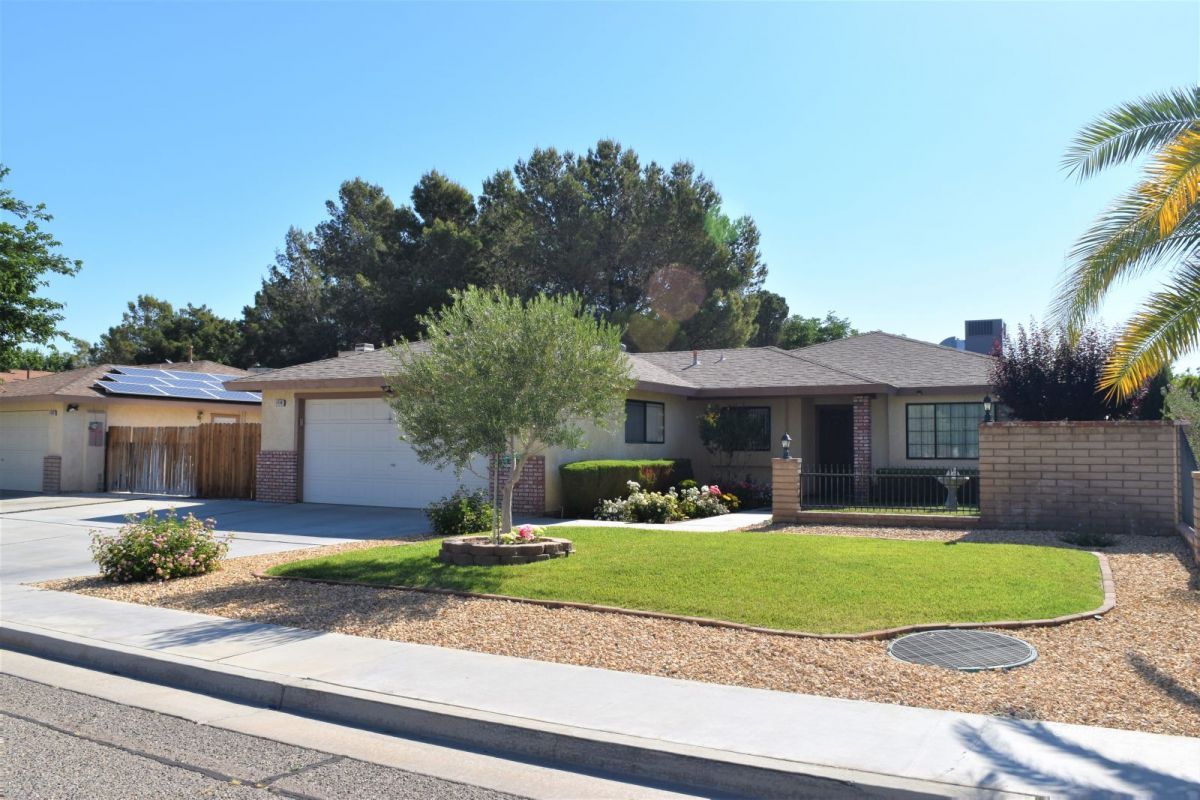 1118 Faith Court Ridgecrest, CA 93555 - Photo 1 of 1 a front view of a house with a yard and garage