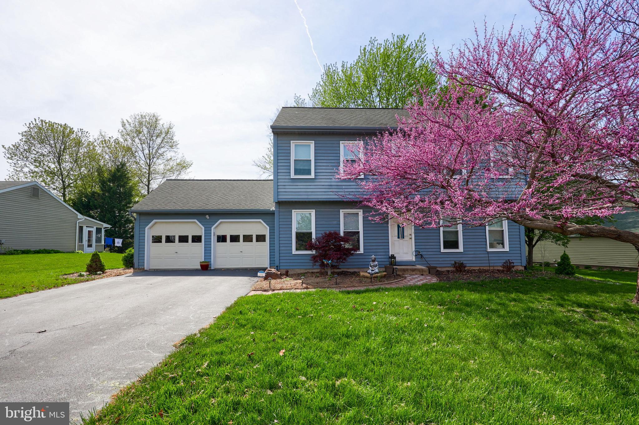 2188 Esbenshade Road York, PA 17408 - Photo 1 of 29 a front view of a house with a garden and trees
