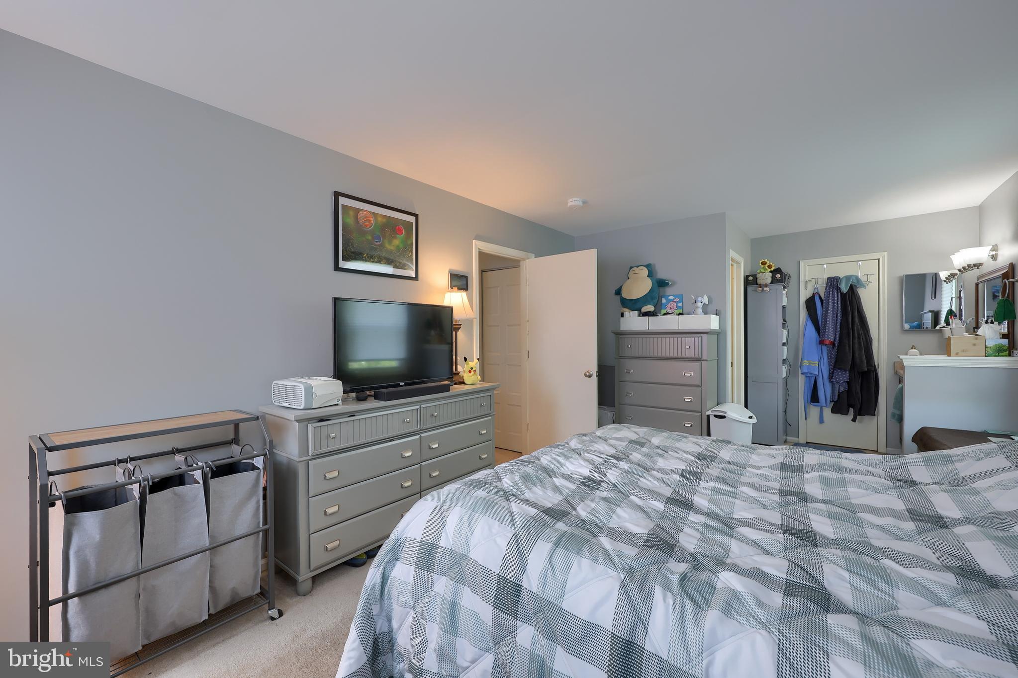 2188 Esbenshade Road York, PA 17408 - Photo 12 of 29 a bedroom with a bed and a flat screen tv