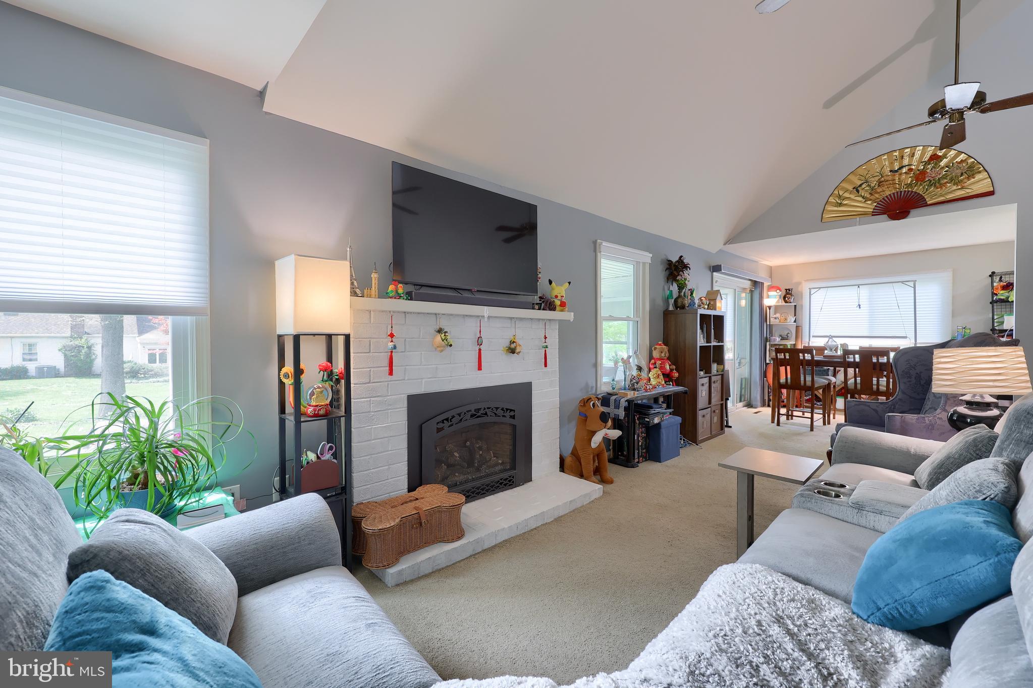 2188 Esbenshade Road York, PA 17408 - Photo 2 of 29 a living room with furniture a fireplace and a window